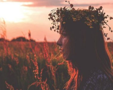 woman in field 678x381