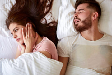 snoring husband in bed 1140x667