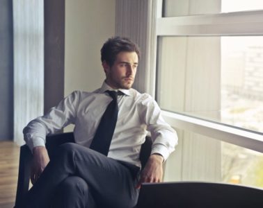 man wearing white dress shirt and black necktie 716411